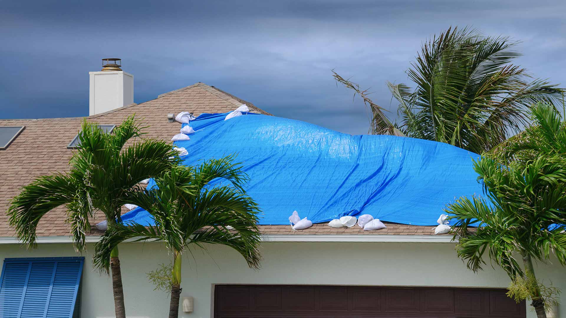 Home with storm damaged roof in Plant City, FL.