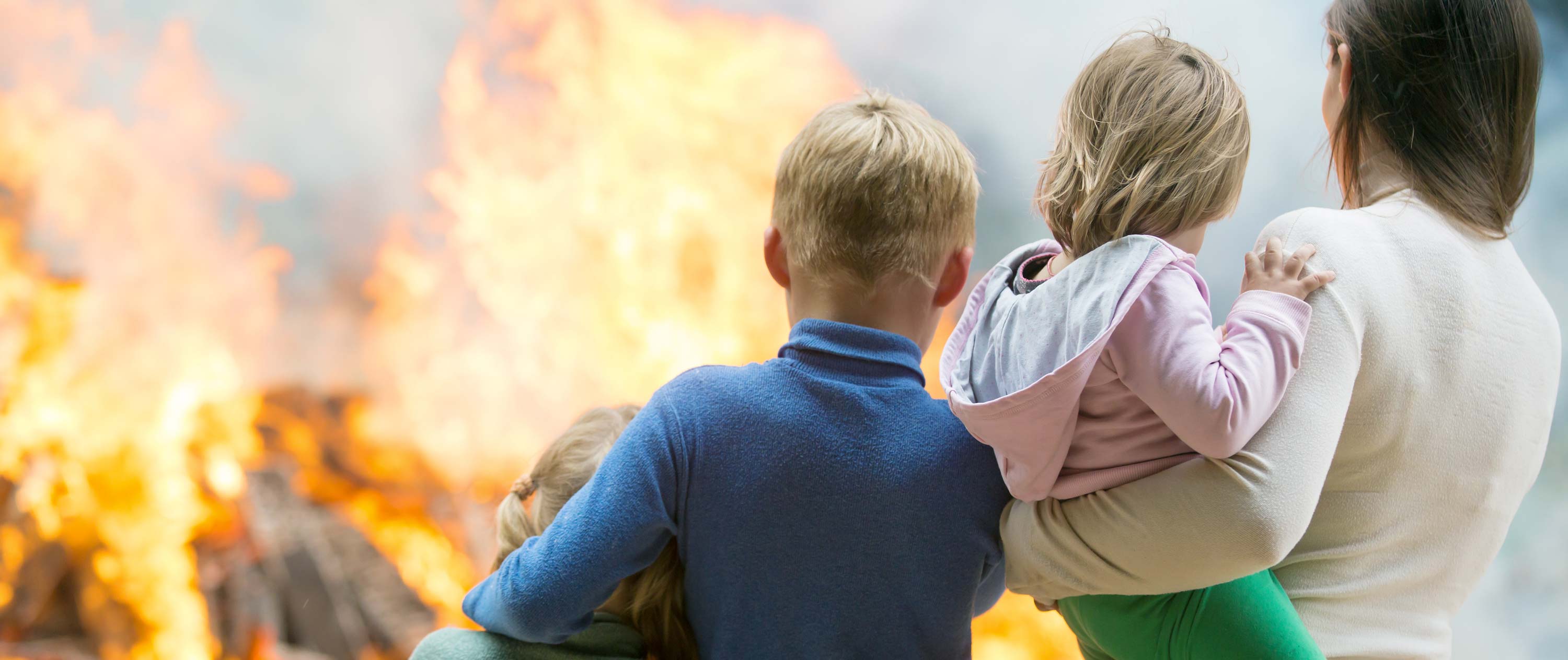A family watches a fire in Winter Haven, FL.