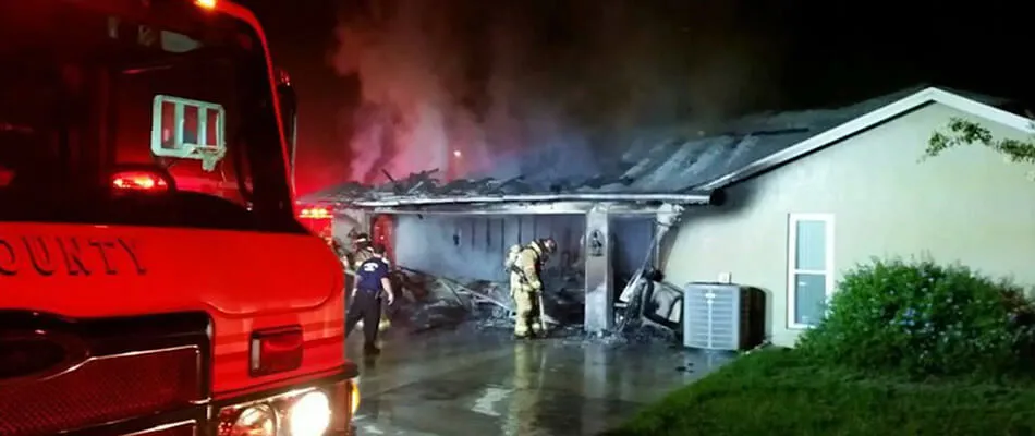Fire department extinguishing home fire in Lakeland, FL.