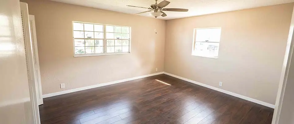 We added new wood flooring and repainted the walls inside of this Winter Haven house.